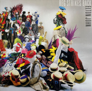 ELTON JOHN - REG STRIKES BACK